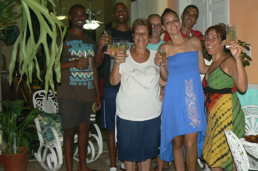 Guests relaxing in the evening at Casa AnaIsa, enjoying drinks and conversations on the terrace